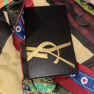 YSL Black and Gold Pocket journal. Ribbon place holder, and unlined pages.